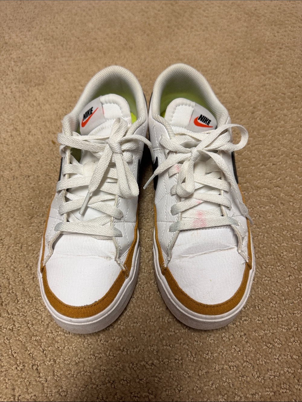 Nike White Sneakers with Brown Trim and Black Swoosh